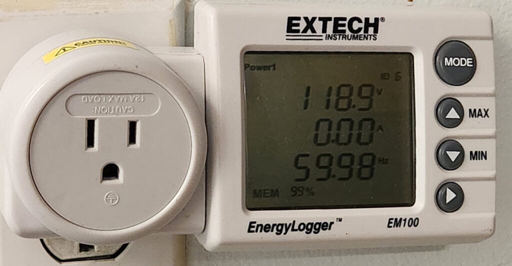 A photo of the Extech EM100, showing readings of 118.9 V, 0 A, and 59.98 Hz